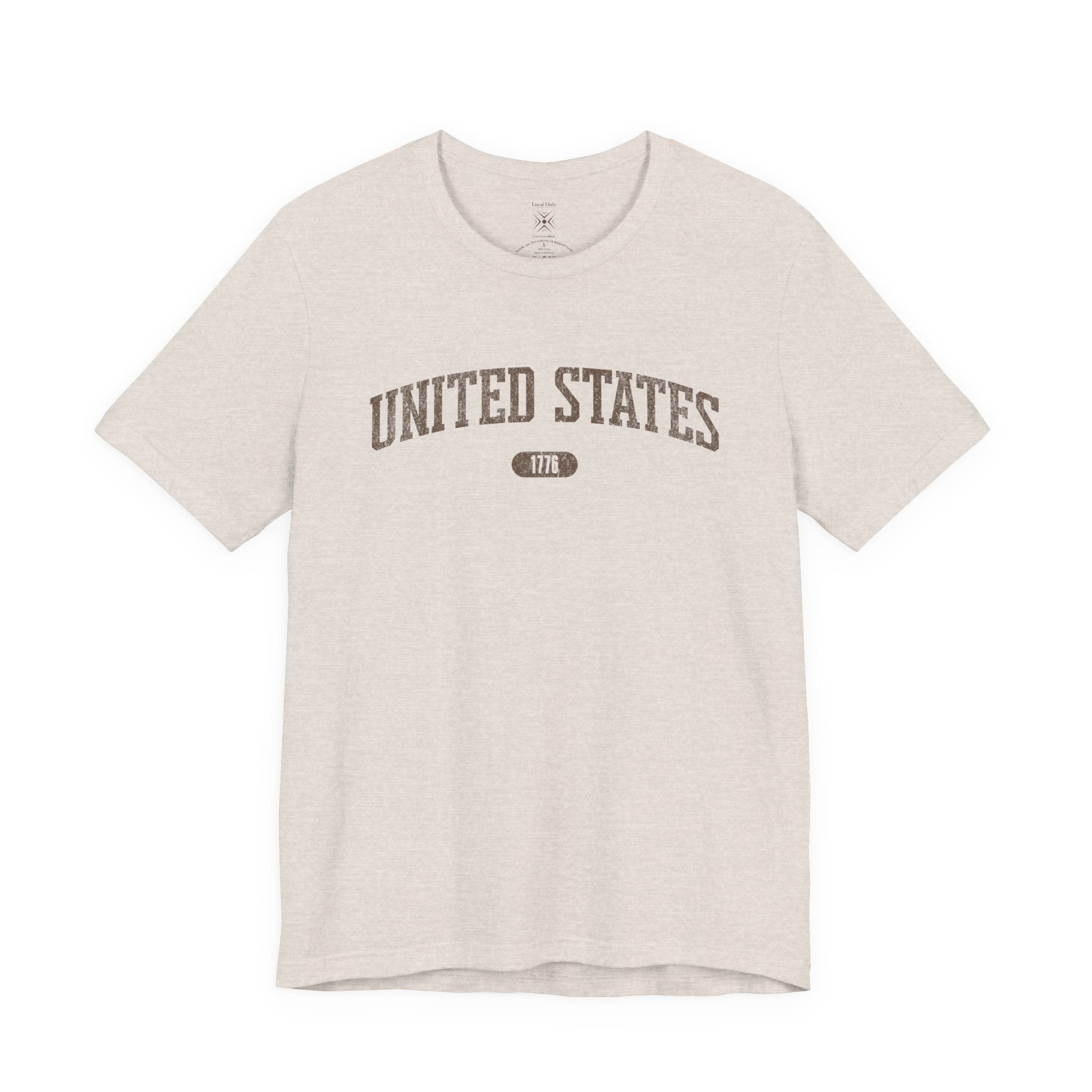 Heather Prism Natural t-shirt with 'UNITED STATES 1776' in brown collegiate text.