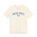 Natural t-shirt with 'UNITED STATES 1776' in blue collegiate text.