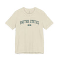 Heather Prism Natural t-shirt with 'UNITED STATES 1776' in teal collegiate text.