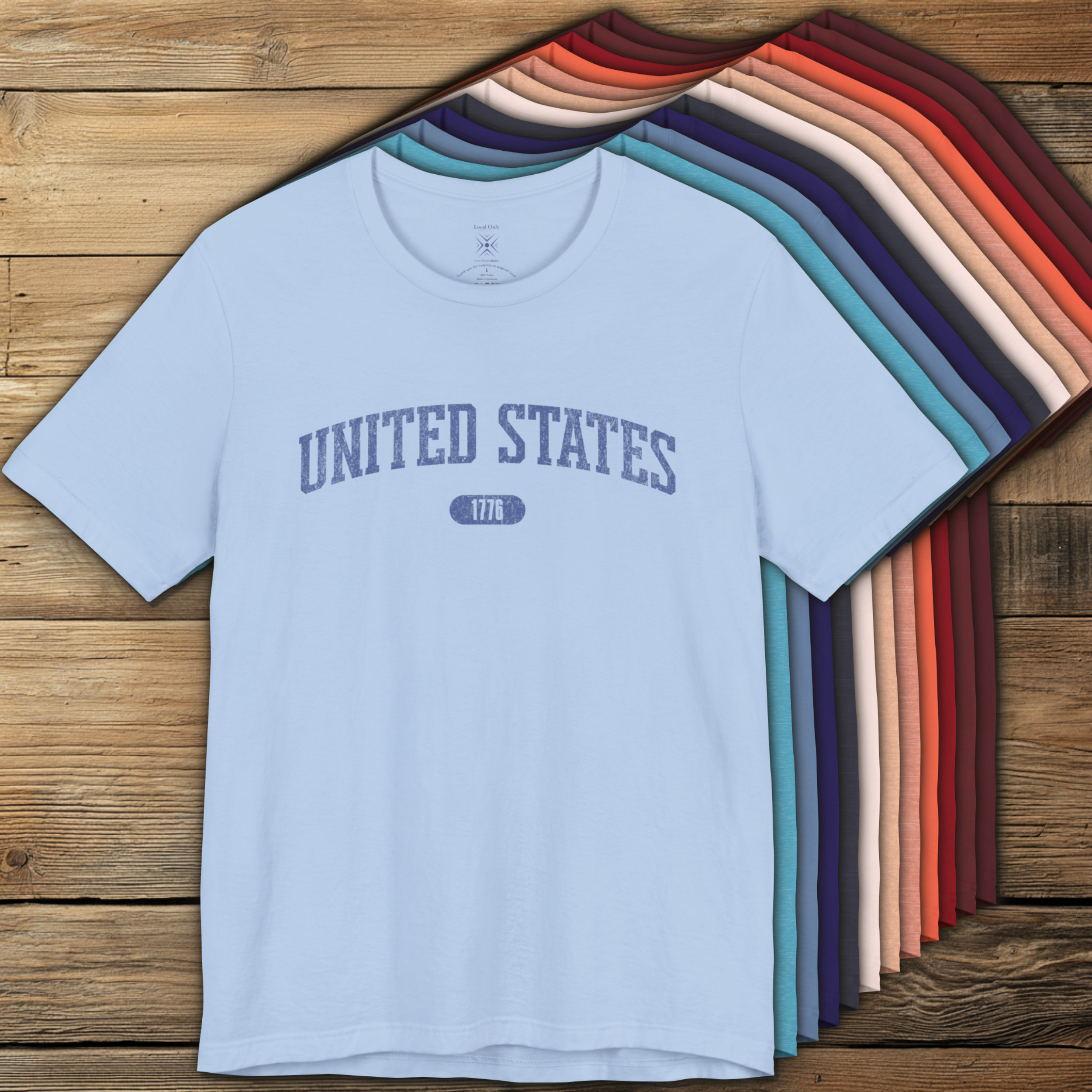 Colorful options of premium varsity tees with 'UNITED STATES 1776' in muted cornflower blue.