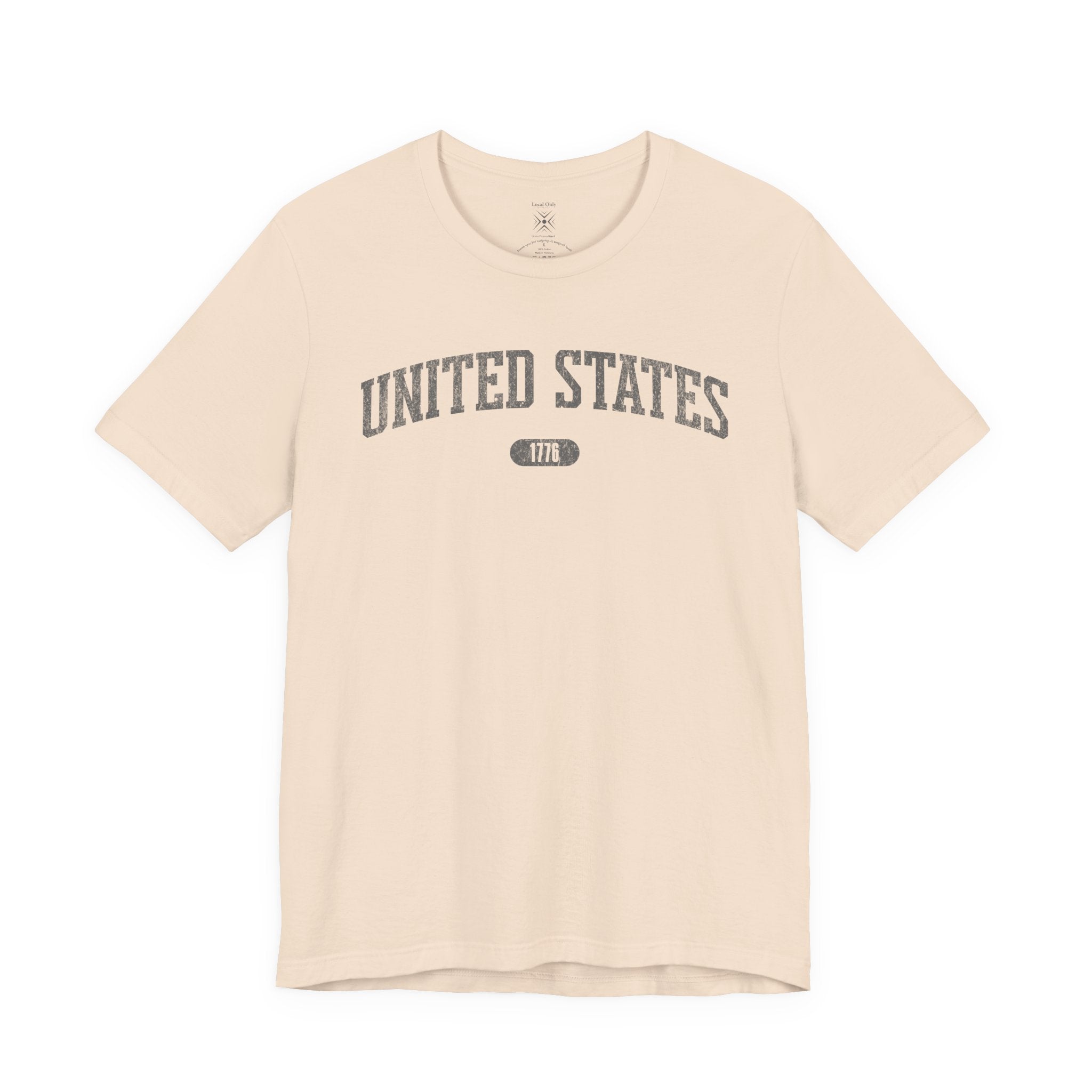 Soft Cream t-shirt with 'UNITED STATES 1776' in gray collegiate text.
