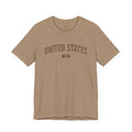 Heather Tan t-shirt with 'UNITED STATES 1776' in brown collegiate text.