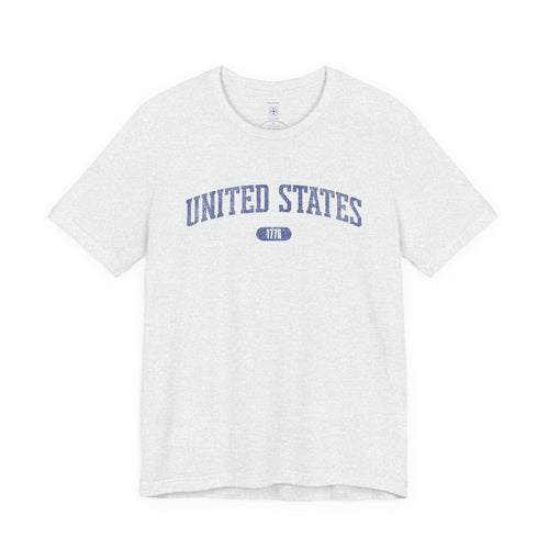 Ash t-shirt with 'UNITED STATES 1776' in blue collegiate text.