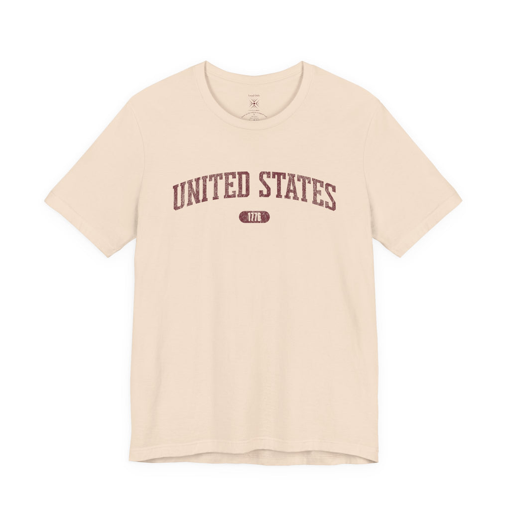 Soft Cream t-shirt with 'UNITED STATES 1776' in burgundy collegiate text.