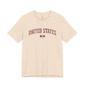 Soft Cream t-shirt with 'UNITED STATES 1776' in burgundy collegiate text.