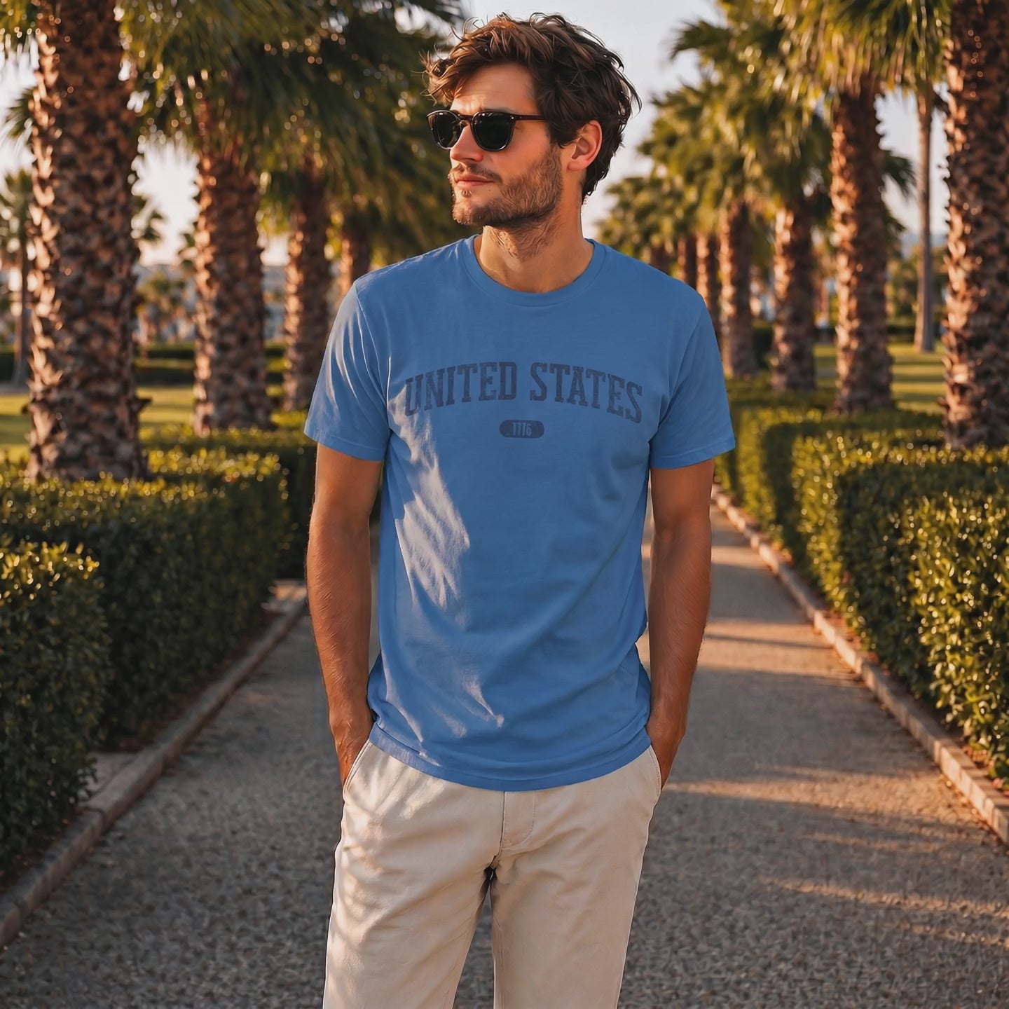 Video of man wearing the Columbia Blue t-shirt with 'UNITED STATES 1776' in navy collegiate text.